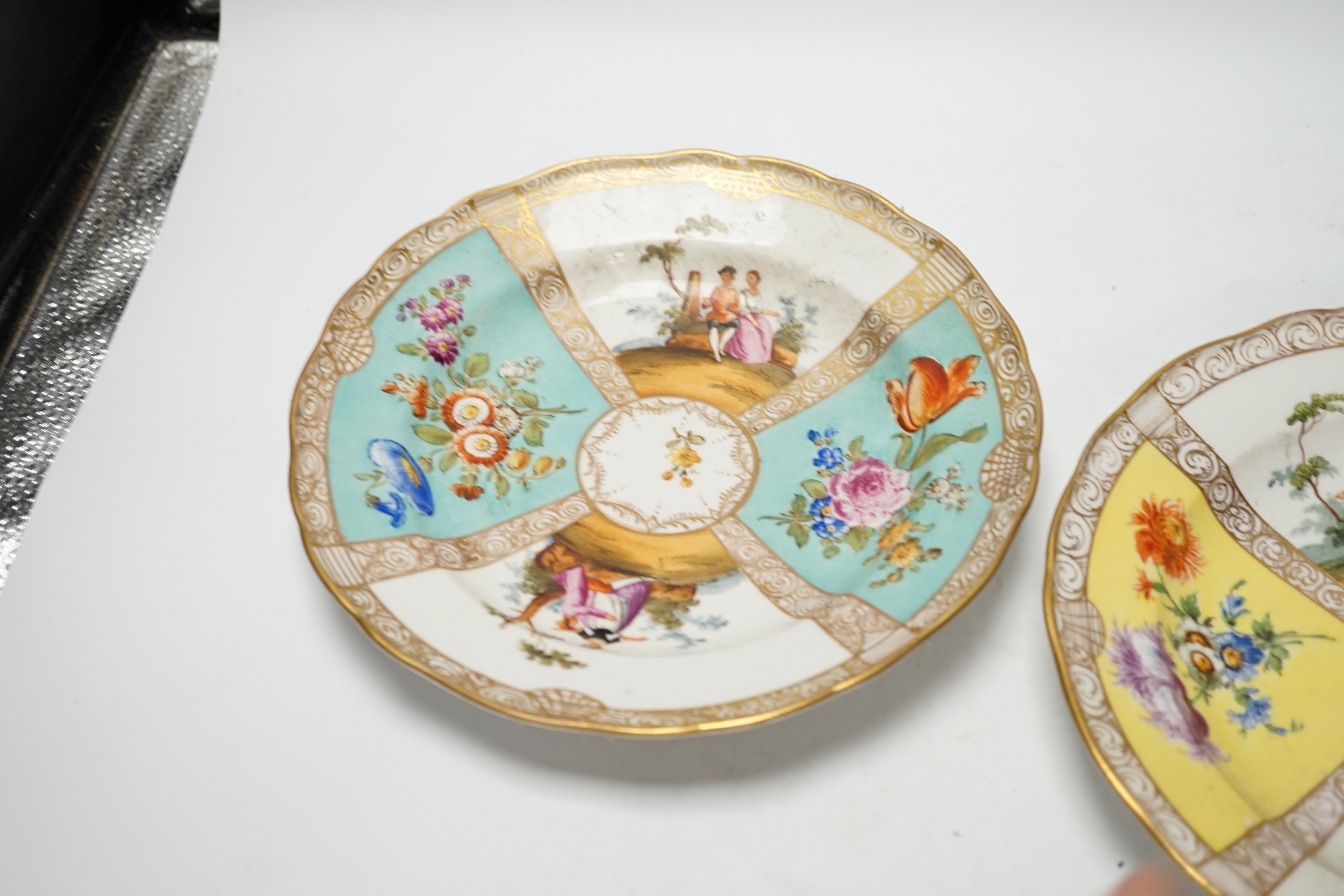 Three Meissen outside figurative and floral decorated plates, 23.5cm diameter